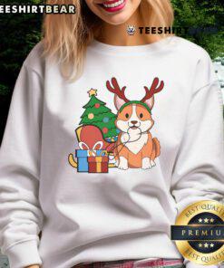 Cute Corgi Dog in Santa hat and reindeer antlers wearing a Christmas gift sweatshirt, perfect for holiday cheer.