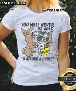 Alt Text: Woman wearing a 'Cute You Will Never Be Able to Afford a House' tee shirt, showcasing trendy fashion for ladies.