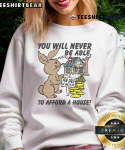 Alt Text: Cute 'You Will Never Be Able To Afford A House' sweatshirt in trendy style, perfect for casual outfits and humor lovers.
