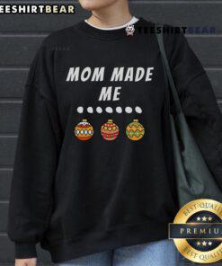 Mom made matching Christmas outfits for a family party, featuring festive ornament sweatshirts and joyful smiles.