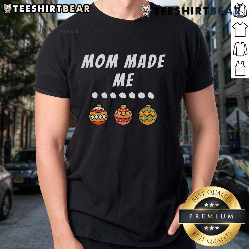 Family party with matching Christmas outfits, featuring a mom-made ornament t-shirt for festive holiday fun.