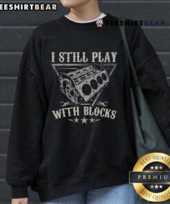 Car mechanic sweatshirt featuring playful block designs, emphasizing creativity and fun for automotive enthusiasts.