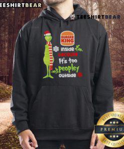 Good Santa Grinch Burger King hoodie worn indoors, avoiding crowded Christmas festivities outside.