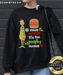 Cozy Christmas sweatshirt featuring Good Santa and Grinch designs, perfect for staying warm indoors during the holiday season.