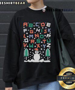 Cozy Good Snowman Alphabet Christmas Sweatshirt featuring a cheerful snowman and festive lettering, perfect for holiday wear.