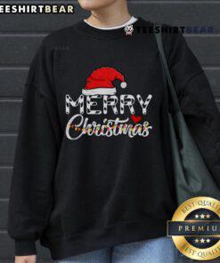 Family in funny Christmas sweatshirts featuring Santa Claus, celebrating a joyful Merry Christmas together.