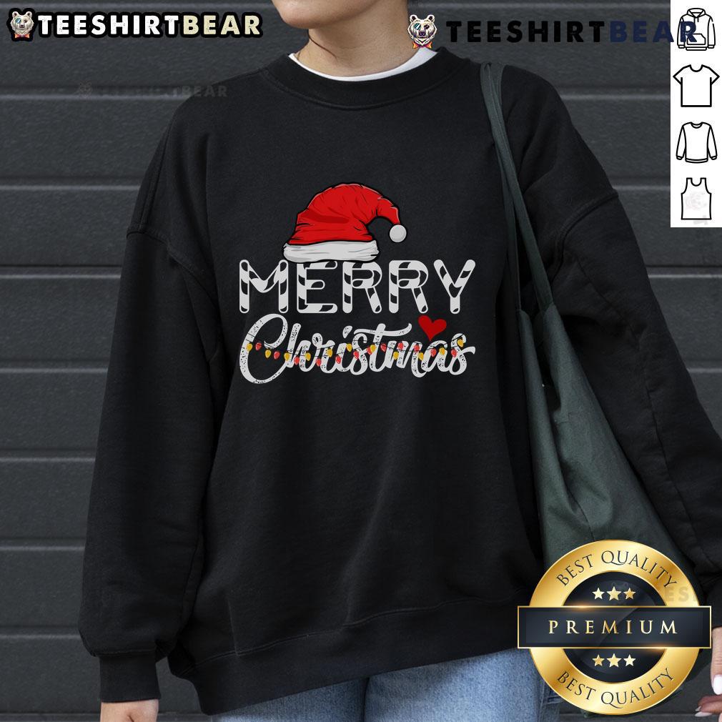 Family in funny Christmas sweatshirts featuring Santa Claus, celebrating a joyful Merry Christmas together.