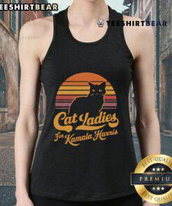 Hot Cat Lady wearing a vintage sunset tank top supporting Kamala Harris at a rally, showcasing fun political fashion.