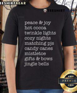 Cozy nights with hot cocoa, twinkle lights, and a 'Nice Peace and Joy' ladies tee for the perfect winter vibe.