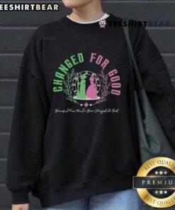 Official Changed For Good Witch pink and green Shiz University sweatshirt for stylish fans of the iconic musical.