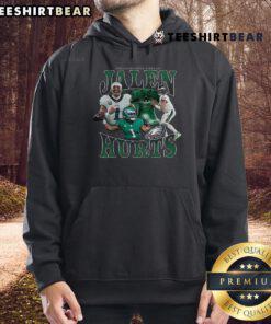 Alt Text: Jalen Hurts wearing the official Philadelphia Eagles Notorious Player Hoodie, showcasing team spirit and style.