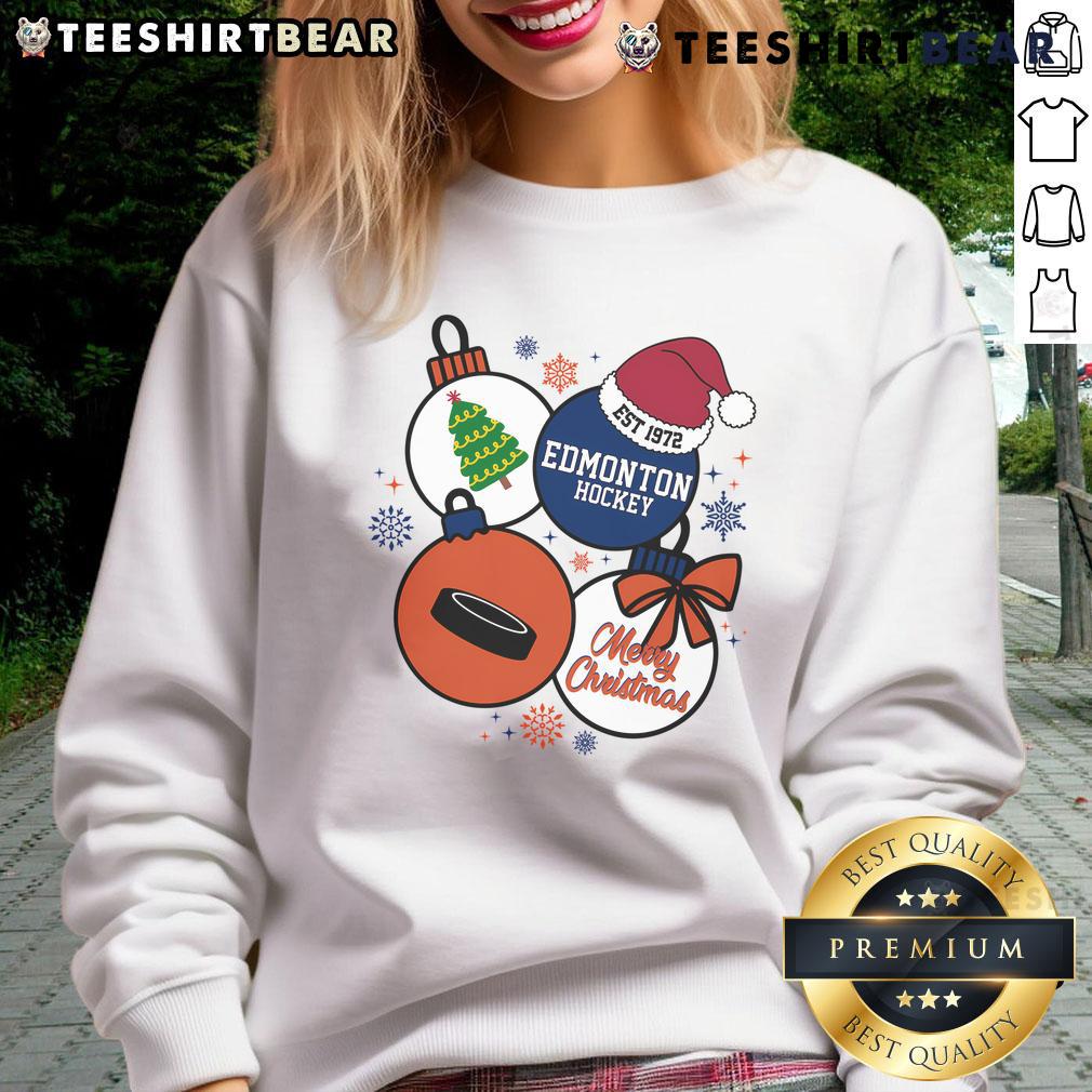 Official Merry Christmas Edmonton Hockey Est 1972 Sweatshirt featuring festive design and team colors for fans.