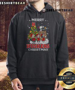Official Nebraska Cornhuskers Snoopy and Friends Merry Christmas Hoodie featuring festive design and team logo.
