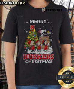 Alt Text: Official Nebraska Cornhuskers Snoopy and Friends Merry Christmas Ladies Tee featuring festive design and team logo.