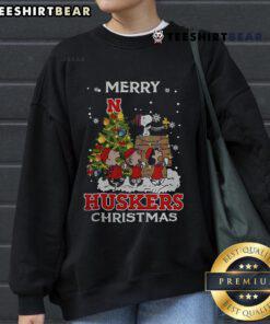 Alt Text: Official Nebraska Cornhuskers Snoopy and Friends Merry Christmas Sweatshirt, featuring festive graphics and team spirit.