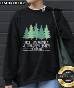 Children wearing the Official Tree Tops Glisten Christmas sweatshirt, enjoying a festive winter scene with snowflakes.