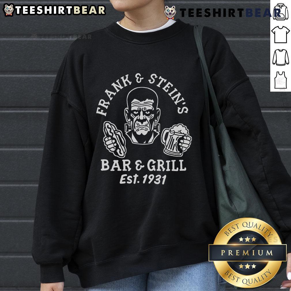 Premium Frank And Steins Bar And Grill funny Halloween party sweatshirt featuring spooky graphics and festive design.