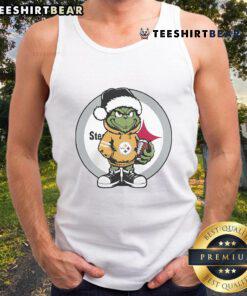 Cheerful Grinch hugging a Christmas ball, featured on a Pittsburgh Steelers tank top for festive holiday spirit.