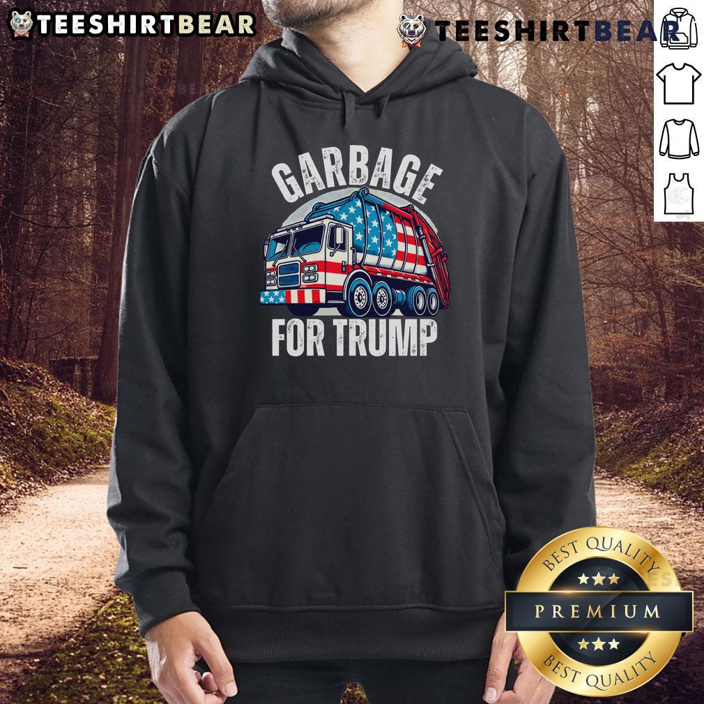 Person wearing a 'Garbage For Trump' hoodie, showcasing support for Trump with a proud expression, in a casual setting.