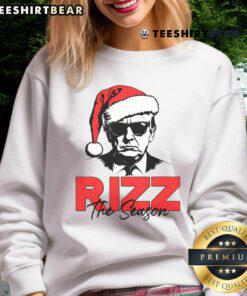 Top Rizz The Season Christmas sweatshirt featuring humorous Trump 2024 Santa Rizzler design for festive style.