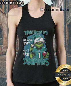 Miami Dolphins tank top featuring 'They Hate Us Because They Ain't Us' slogan, perfect for fans supporting their team.