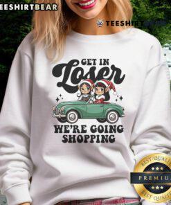 Cute 'Get In Loser, Elves We're Going Shopping' Christmas sweatshirt design featuring festive colors and playful graphics.