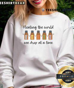 Cute Healing the World One Drop at a Time sweatshirt with colorful design, perfect for eco-friendly fashion lovers.