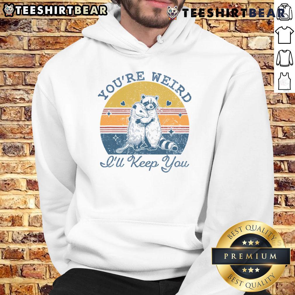 Alt Text: Cute 'You're Weird, I'll Keep You' sunset hoodie on display, showcasing vibrant colors and playful design.