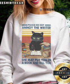 Alt Text: Funny 'Please Do Not Annoy The Writer' cat sweatshirt, perfect for writers and cat lovers, showcasing humor and creativity.