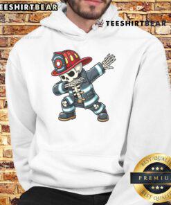 Funny skeleton firefighter dabbing in a Halloween costume hoodie, perfect for spooky celebrations and festive events.