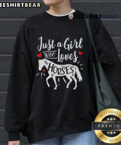 Girl wearing a Funny Sweet Horse Riding sweatshirt, showcasing her love for horses in a playful outdoor setting.