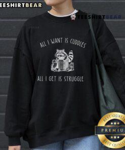 Cozy 'All I Want Is Cuddles, All I Get Is Struggles' sweatshirt featuring playful text, perfect for casual comfort.