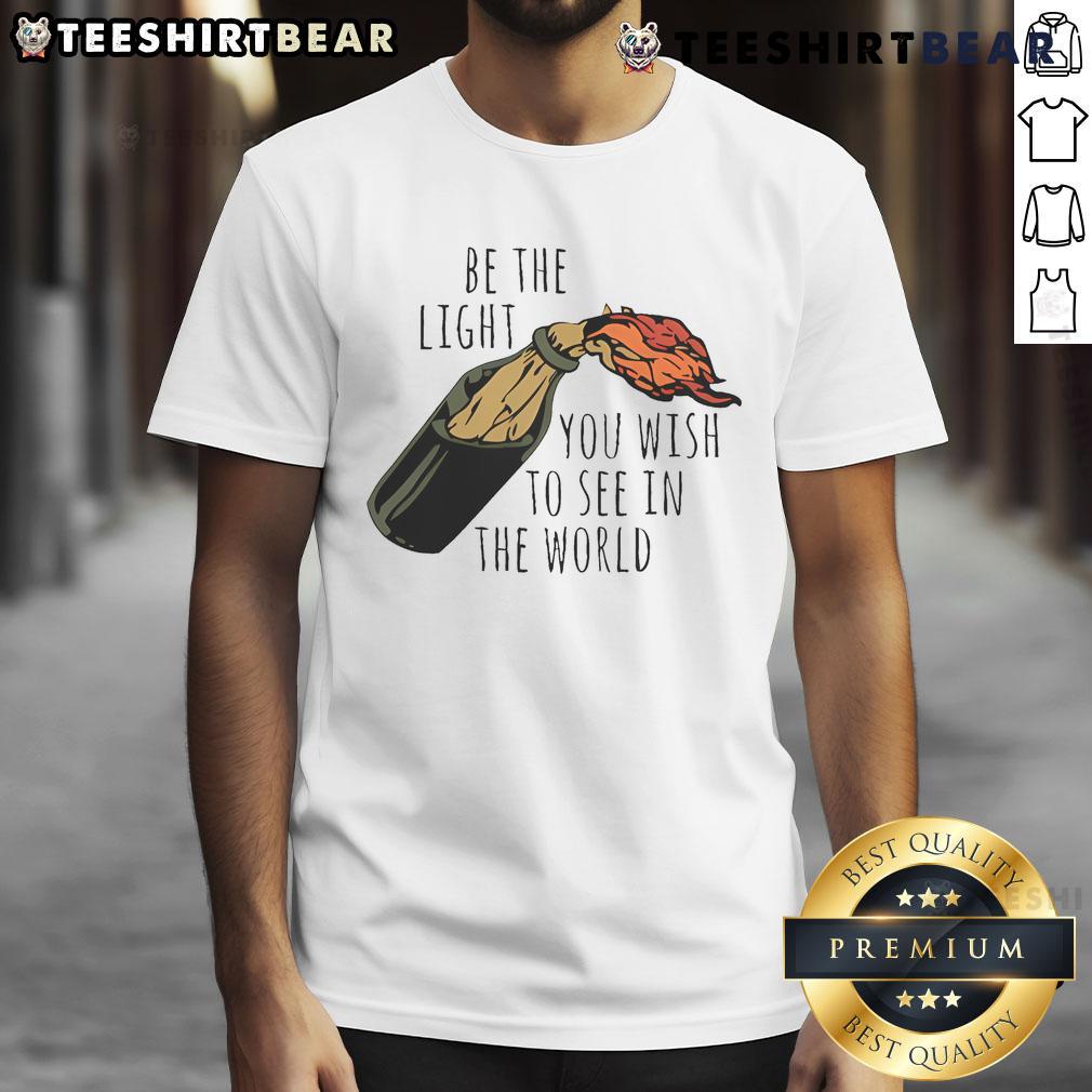 Good Be The Light You Wish To See In The World T-Shirt featuring a motivational quote in stylish typography.