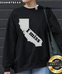 Cozy 'I Miss California' sweatshirt featuring California state outline, perfect for nostalgic Californians.