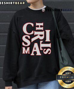 Festive Christmas typography on a Santa Claus sweatshirt, perfect for cozy holiday pajamas and seasonal celebrations.