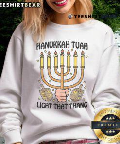 Good Hanukkah Tuah Light That Thing Sweatshirt featuring festive design, perfect for celebrating the holiday season.