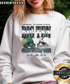 2024 Big Ten Football Championship sweatshirt featuring Oregon Ducks and Penn State Nittany Lions team helmets.