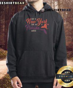 Good Proud Girl in a 'New York Girl in a Florida World' hoodie, showcasing vibrant style and urban flair.