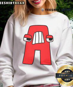 Boy in Good Villain Letter ABC costume, wearing matching Evil Alphabet sweatshirt, showcasing playful villain style.