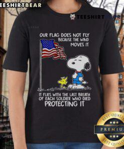 Happy Snoopy and Woodstock graphic on a ladies tee featuring 'Our flag does not fly because the wind' quote.