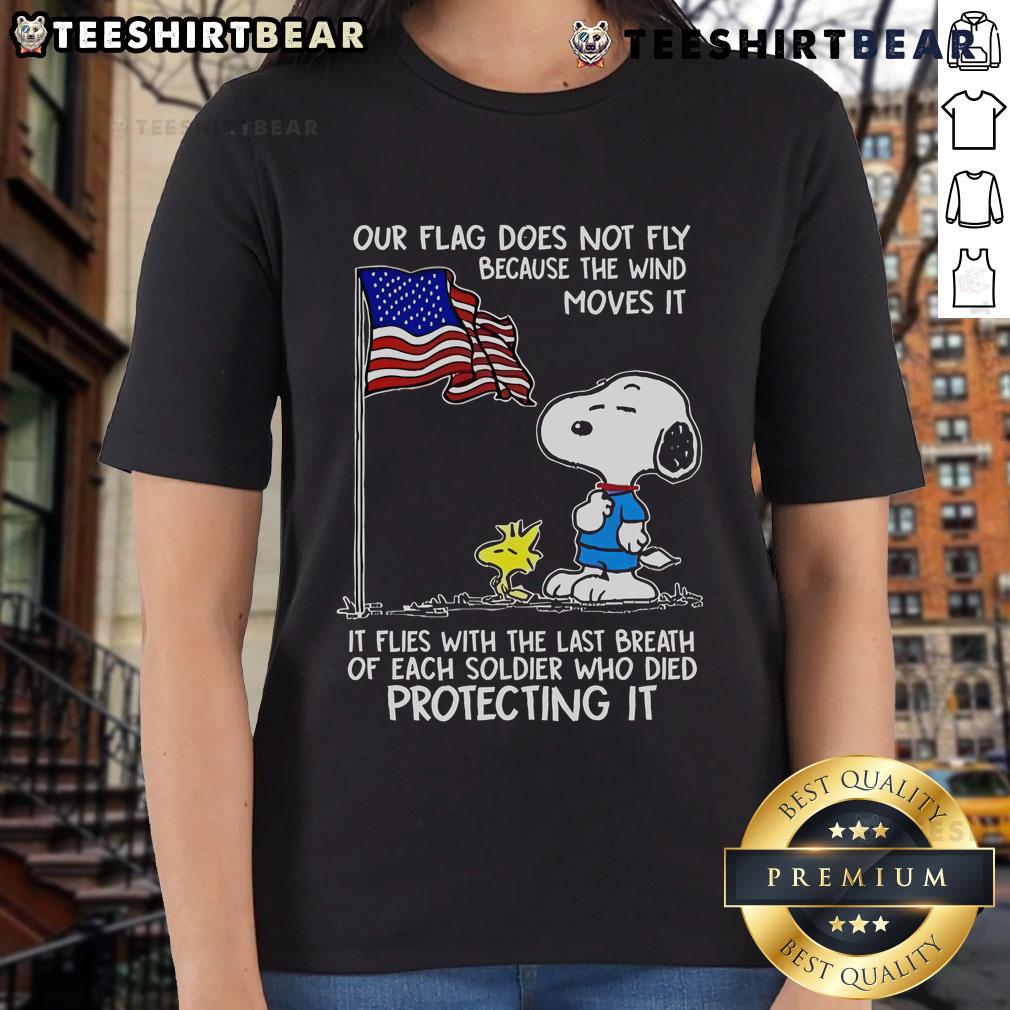 Happy Snoopy and Woodstock graphic on a ladies tee featuring 'Our flag does not fly because the wind' quote.