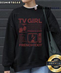 Stylish hot TV girl wearing a French's Exit sweatshirt, showcasing contemporary fashion in a vibrant urban setting.