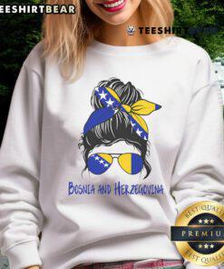 Smiling Bosnian girl wearing a stylish sweatshirt, showcasing Bosniak culture in Bosnia and Herzegovina.