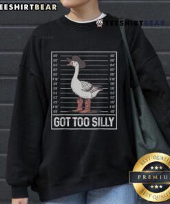 Stylish cowgirl boots paired with a fun 'Silly Goose' sweatshirt, perfect for a trendy country look.