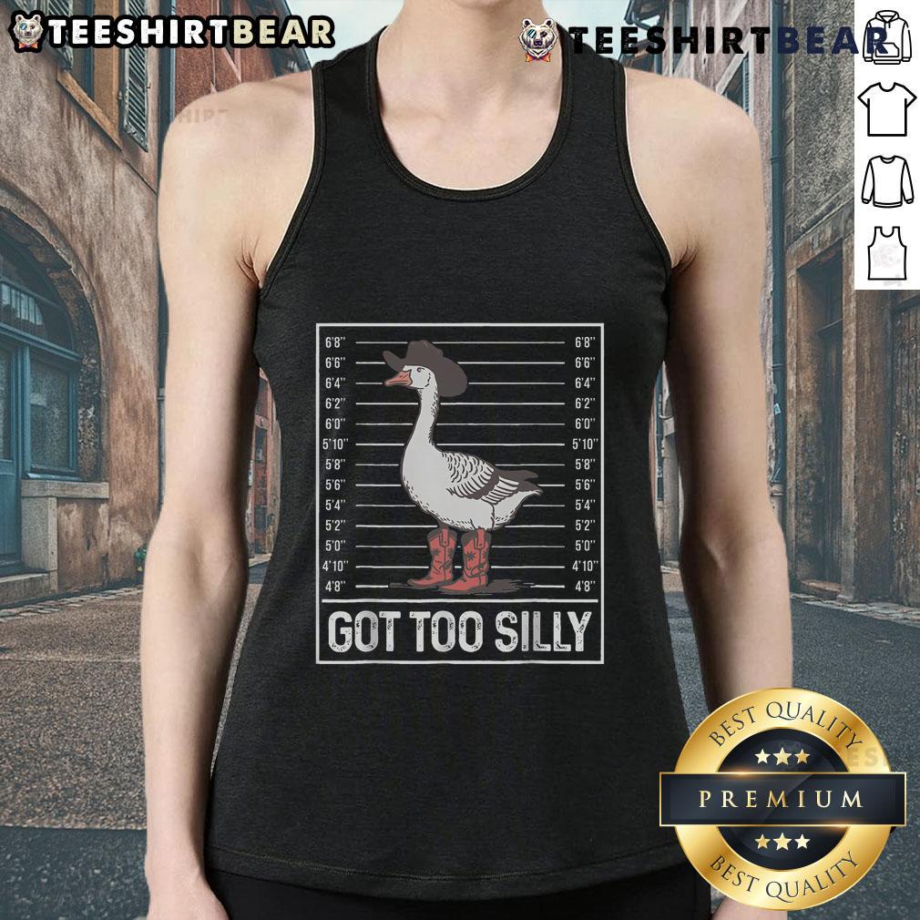 Stylish cowgirl boots paired with a playful 'Silly Goose' tank top for a fun, trendy look.