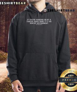Close-up of the nice hem of a Christian hoodie, showcasing its stylish design and quality craftsmanship.