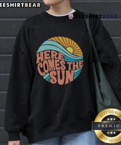 Cozy Nice Here Comes The Sun sweatshirt in vibrant colors, perfect for warm-weather layering and casual style.