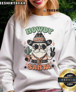Cute Santa cow in Christmas costume on Nice Howdy sweatshirt, perfect for festive holiday celebrations.