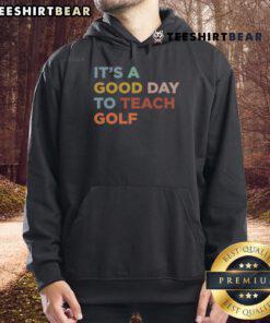 Alt Text: Golf coach wearing a 'Nice-Itt-A-Good-Day-To-Teach-Golf' hoodie on the course, ready to inspire players.
