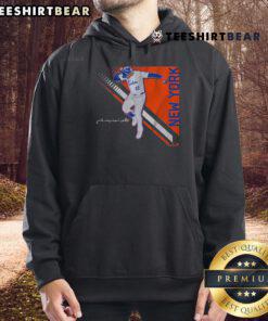 Juan Soto in a stylish pose wearing the Nice Juan Soto Queens Superstar Pose 2.0 Hoodie, showcasing athletic fashion.